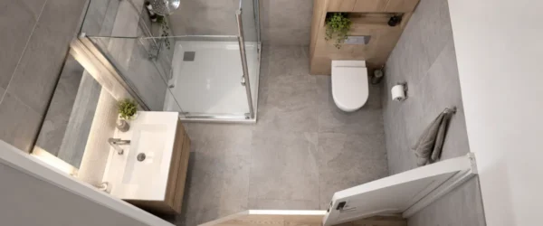 Łazienka 4 m² z narożnym prysznicem, WC i umywalką z szafką